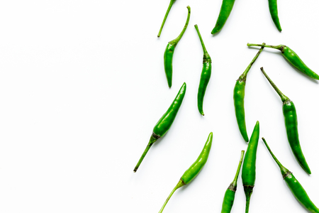 cooking sauce with green chili pepper on white kitchen table background top view mock upの写真素材