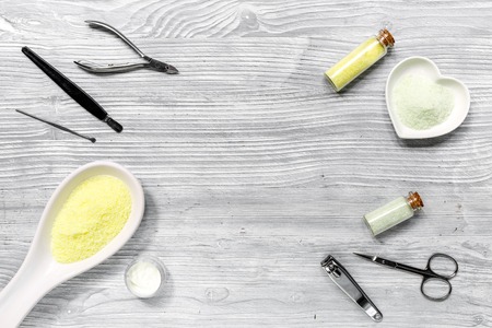 hands care set for manicure with chamomile on gray wooden background top view space for textの写真素材