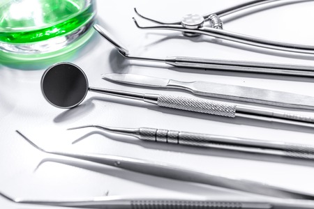 dentist desk with instruments on white backgroundの写真素材
