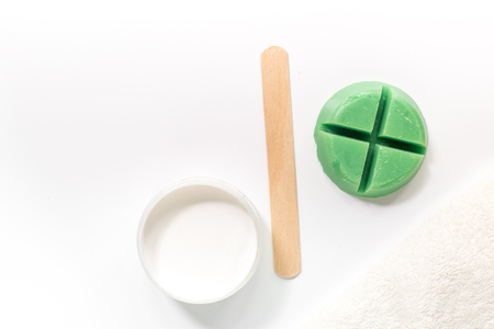Wax and stick for depilation on white background top view copyspaceの写真素材
