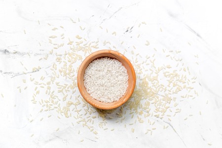 paella ingredients with rice on white table background top view mock upの写真素材