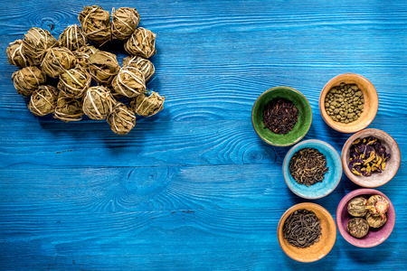 Different kinds of herbal tea on blue background top view mockupの写真素材