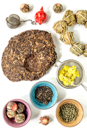 Tea-party with different herbal tea on white desk background flat lay patternの写真素材