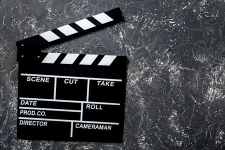 Movie clapperboard on grey stone table background top view copyspaceの写真素材