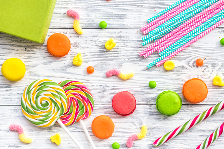 Birthday concept with wrapped gift and sweets on grey background top viewの写真素材