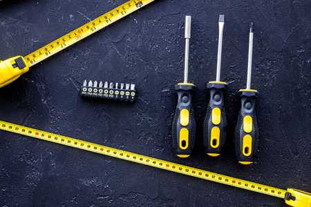 Tools for repairing on black stone table background top view.の写真素材