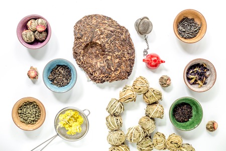 Different kinds of herbal tea on white table background top viewの写真素材