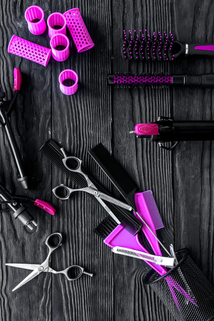 Hairdresser set on grey wooden background top view.の写真素材