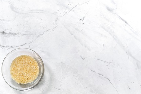 paella home cooking with rice for ingredients on white background top view space for textの写真素材