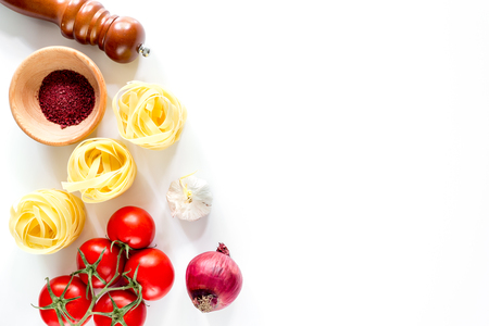 Preparing for cooking italian pasta white background top view copyspaceの写真素材