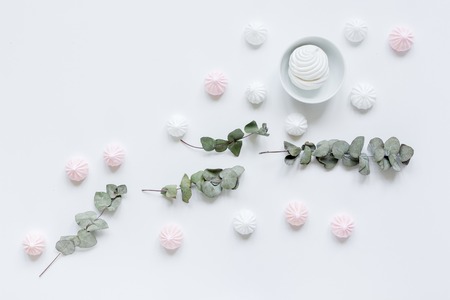 sweet marsh-mallow and flowers on woman white desk background top viewの写真素材