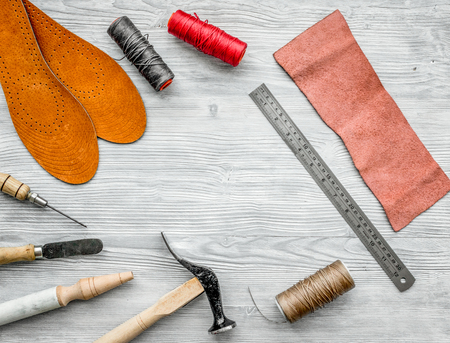 Work desk of clobber. Skin and tools on grey wooden desk background top view copyspaceの写真素材