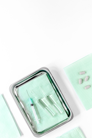 Preparing for cosmetic surgery white table background top view copyspaceの写真素材