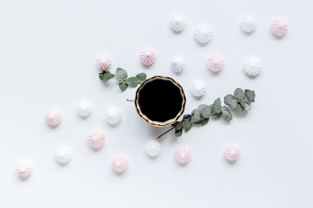 light breakfast with marsh-mallow and coffee on white table background top viewの写真素材