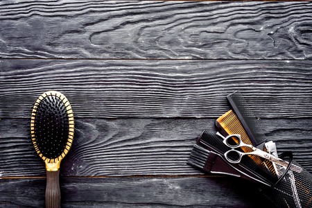 Hairdressing tools on grey wooden background top view space for textの写真素材