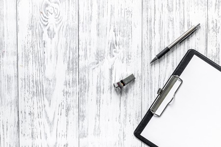 To judge competition. Whistle, pad and pen on wooden table background top view copyspace mockup.の写真素材
