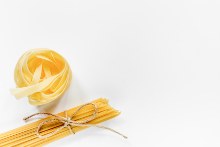 Italian food concept various kind of pasta on white background top view copyspace.の写真素材