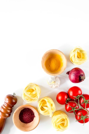 Preparing for cooking italian pasta white background top view copyspace.の写真素材