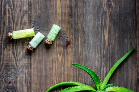 Organic aloe vera cosmetics. Aloe vera leafs and spa salt on wooden table background top view.の写真素材