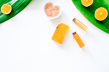 Aroma spa set. Citrus soap, salt and lotion on white background top view.の写真素材