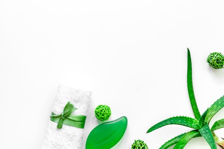 Natural herbal skin care. Aloe vera leafs and soap on white background top view.の写真素材