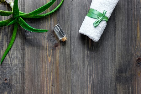 Skin care. Aloe vera gel and aloe vera leafs on wooden background top view copyspaceの写真素材