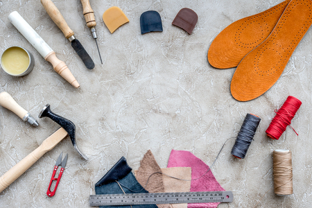 Tools for repairing shoes on grey stone desk background top view space for text.の写真素材