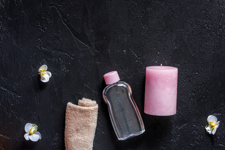 Candles for aroma relax bath on black table background top view.の写真素材