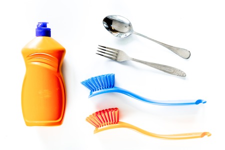 Wash dishes. Liquid and brushes on white background top viewの写真素材