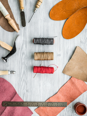 Work desk of clobber. Skin and tools on grey wooden desk background top viewの写真素材