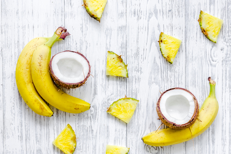 Appetizing cocount, banana and on wooden table background top view.の写真素材