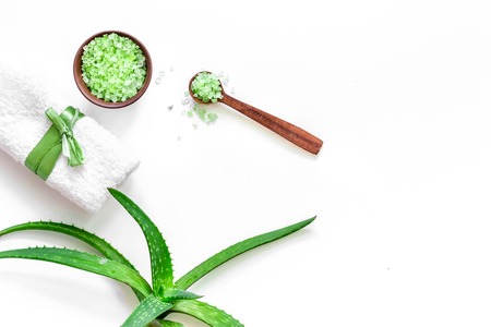 Skin care. Aloe vera leafs and spa salt on wooden background top view.の写真素材