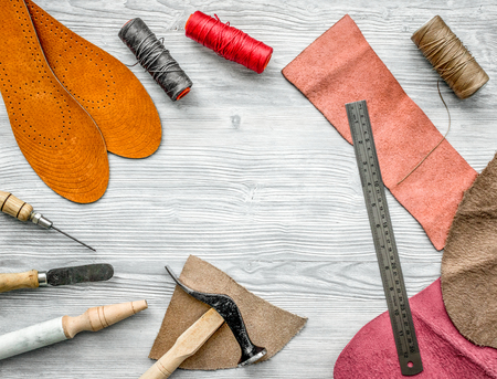 Work desk of clobber. Skin and tools on grey wooden desk background top view copyspace.の写真素材