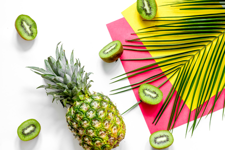 Concept of summer tropical fruits. Pineapple on table background top view.の写真素材