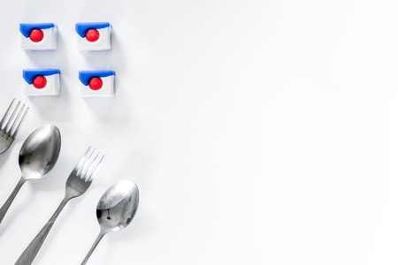 Wash dishes. Liquids and brushes on white background top view.の写真素材