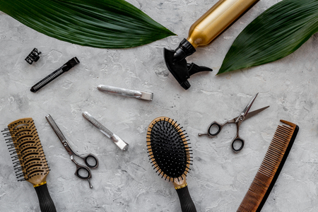 Beauty saloon. Haidressing tools on grey table background top view.の写真素材