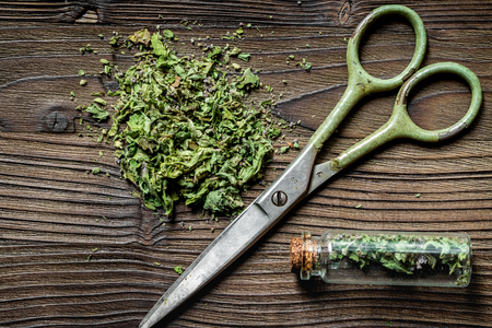 Alternative medicine. Store up medicinal herbs. Herbs on wooden table background.の写真素材