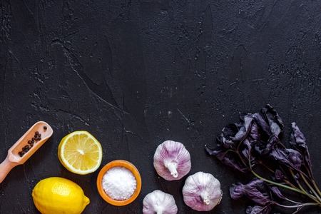 Cook workplace. Vegetables on black table background top view.の写真素材