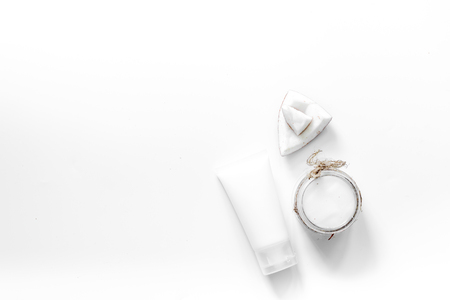Body treatment. Coconut cosmetics on white background top view copyspace.の写真素材