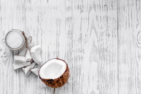 Organic cosmetics with coconut. Coconut oil on wooden background top view copyspaceの写真素材