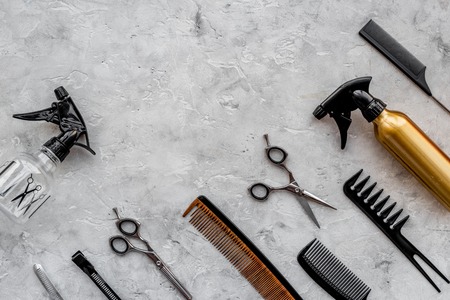 Beauty saloon. Haidressing tools on grey table background top view.の写真素材