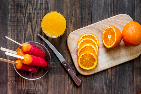 Citrus concept. Fresh oranges on wooden table background top view.の写真素材