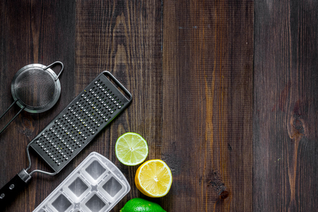 Making lemonade. Cookware and fruits on wooden table background top view.の写真素材