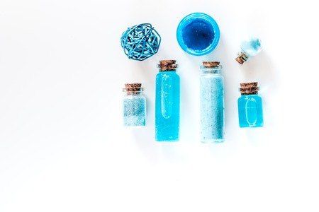 Spa set with sea salt, blue clay and lotion on white background top view copyspaceの写真素材