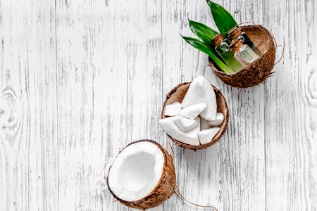 Organic cosmetics with coconut. Coconut lotion on wooden background top view copyspaceの写真素材