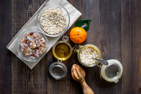 Preparing healthy breakfast with oranges on dark wooden table top view copyspaceの写真素材