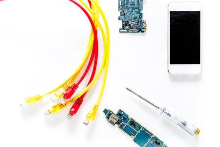 Repairing gadgets. Parts and tools on white background top view.の写真素材