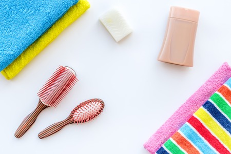 Bathroom set. Towels and bottles with soap and shampoo on white backgrond top view.の写真素材