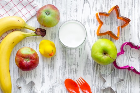 Kids breakfast with fruits on light wooden table background top view.の写真素材