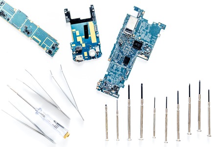 Parts of disassembled cell phone on white background top view.の写真素材